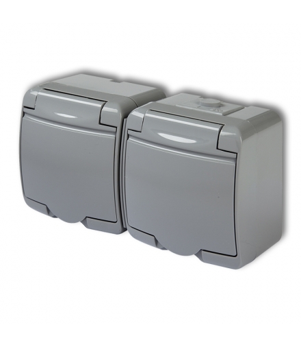 JUNIOR Gniazdo podwójne z uziemieniem SCHUKO 2x(2P+Z) (klapka popielata, bez przesłon) Karlik 10GHE-2s